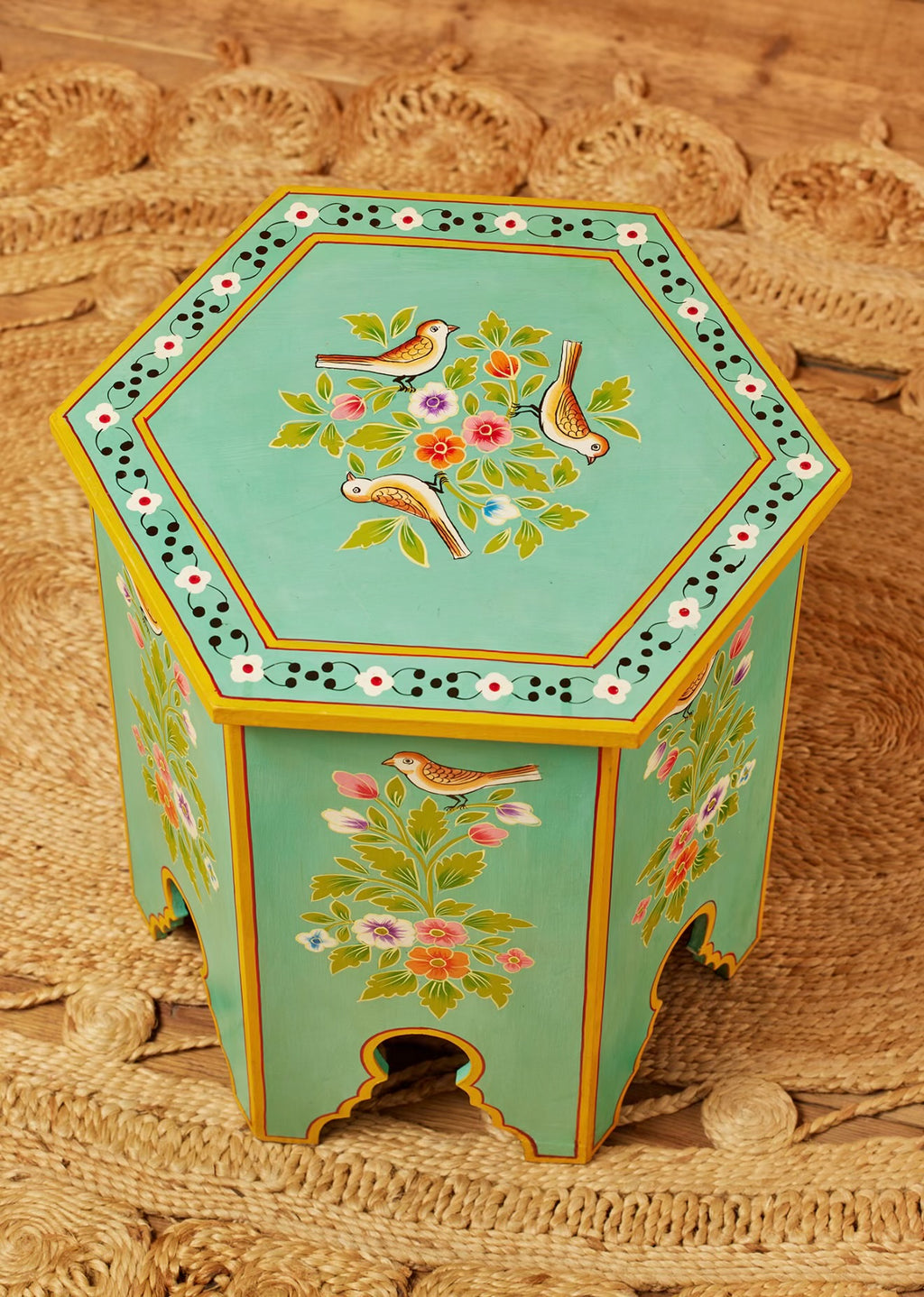 Top view of the smaller Chaman turquoise hexagonal table with hand-painted birds and flowers