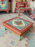 The Gulbahar low square hand-painted accent table with floral motifs and mint green legs