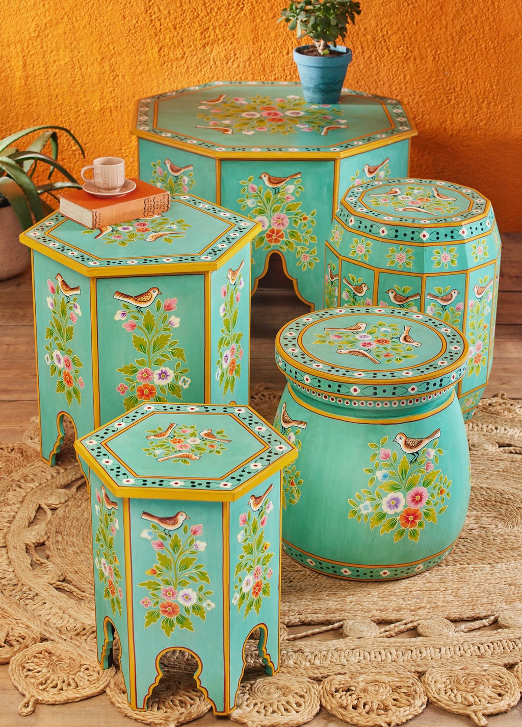 The Gulshan hand-painted octagonal coffee table styled with matching turquoise floral furniture