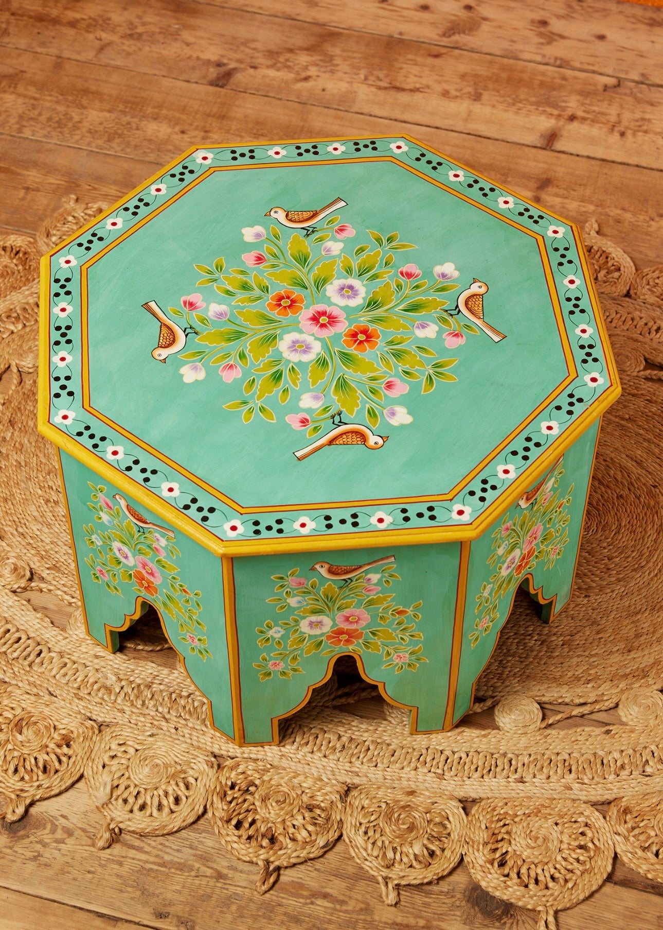Top view of The Gulshan turquoise octagonal coffee table with hand-painted flowers and birds