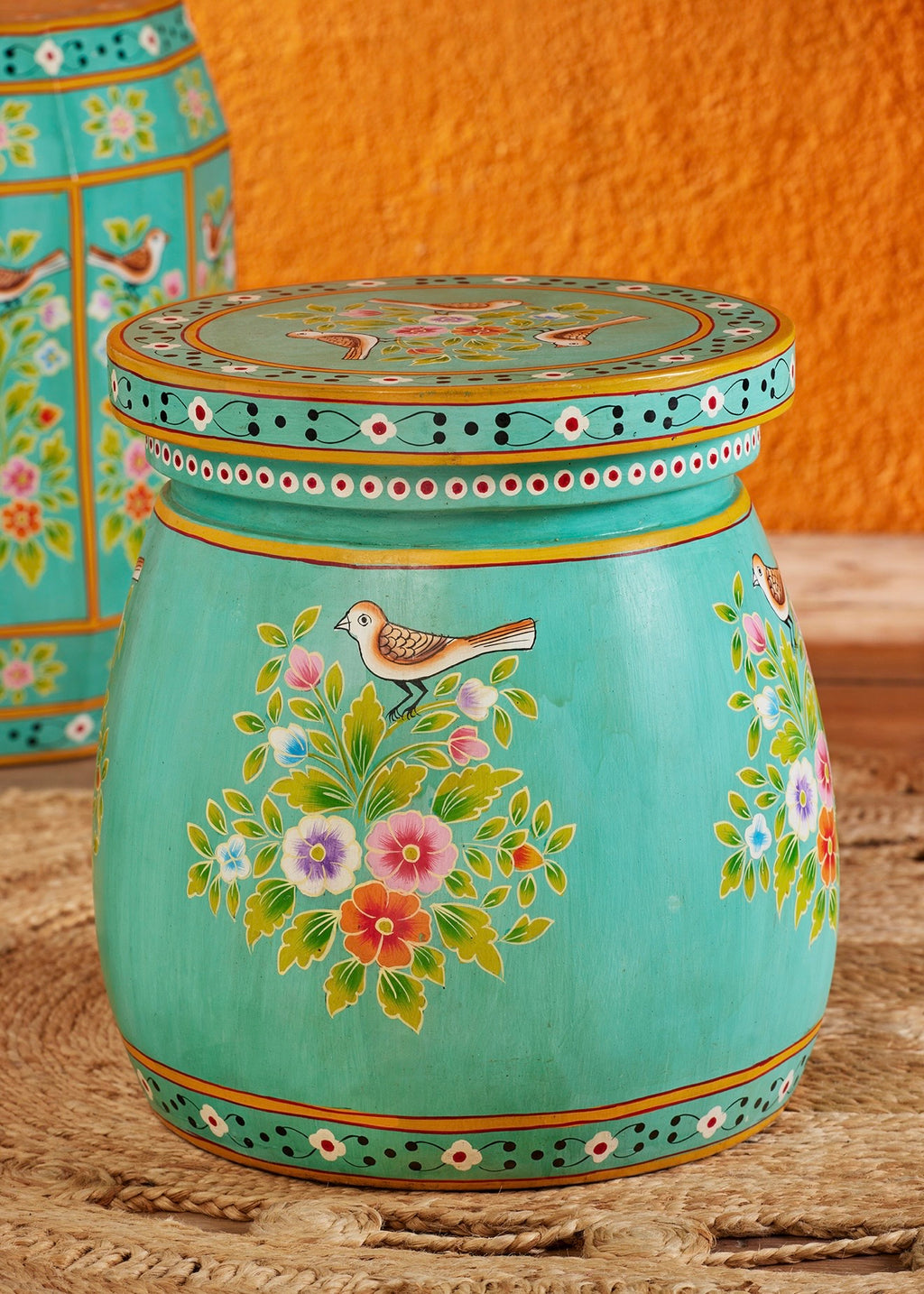 Hand-painted turquoise drum side table with floral and bird motifs