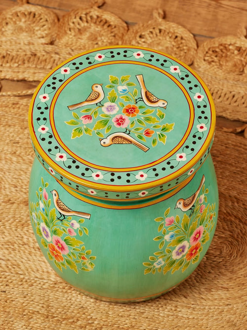 Top view of turquoise hand-painted round accent table with birds and floral artwork