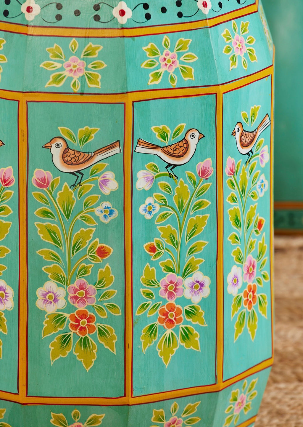 Close-up of hand-painted songbirds and floral detailing on The Bulbul Accent Table
